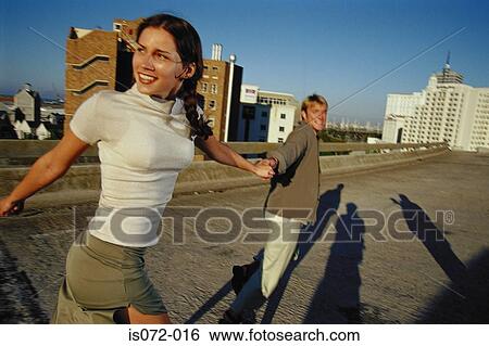 Couple running outdoors View Large Photo Image Stock Photograph - Couple running outdoors. Fotosearch