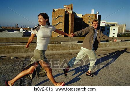 Stock Photography - Couple running outdoors. Fotosearch