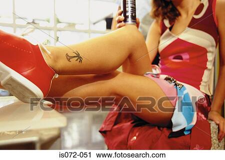 Stock Image - Girl in shoe shop. Fotosearch
