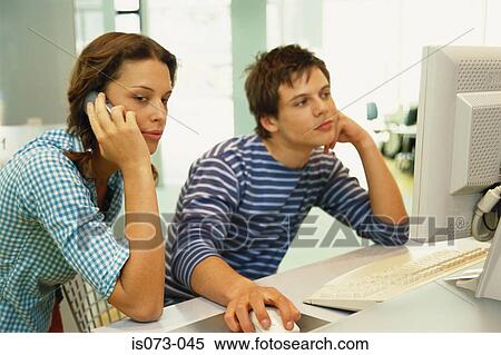 Stock Photography - Couple at computer. Fotosearch