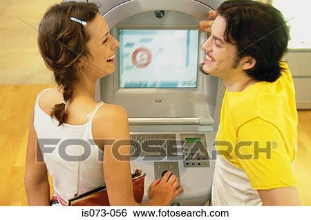 Couple at Internet terminal View Large Photo Image Stock Photograph - Couple at Internet terminal. Fotosearch
