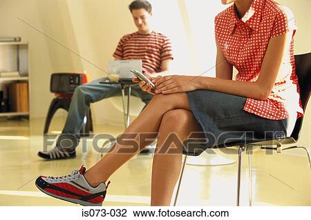 Stock Image - Girl with mobile phone. Fotosearch