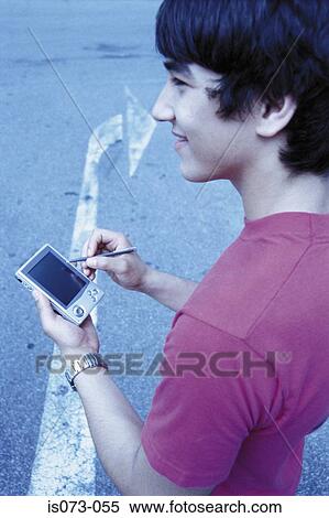Man with pocket PC View Large Photo Image Stock Photography - Man with pocket PC. Fotosearch