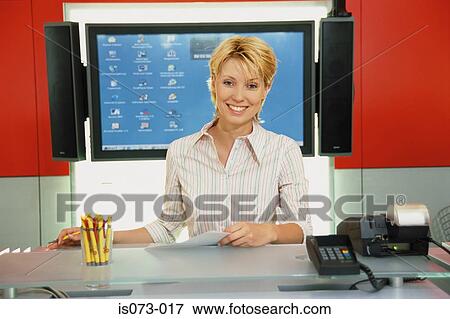 Woman at desk View Large Photo Image Stock Photo - Woman at desk. Fotosearch