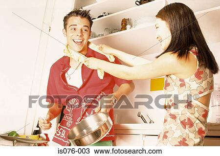 Couple in kitchen View Large Photo Image Stock Image - Couple in kitchen. Fotosearch