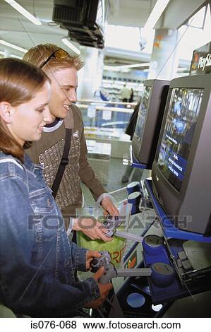 Stock Photo - Couple playing video games. Fotosearch