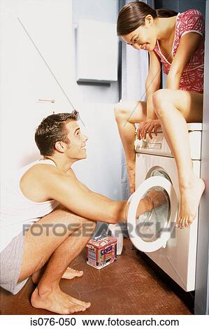 Couple with washing machine View Large Photo Image Stock Image - Couple with washing machine. Fotosearch