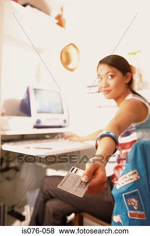 Stock Photo - Girl Internet-shopping. Fotosearch
