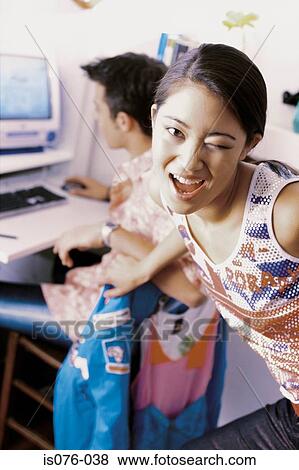 Stock Photo - Girl winking. Fotosearch
