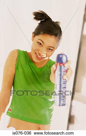 Girl with hairspray View Large Photo Image Stock Photograph - Girl with hairspray. Fotosearch