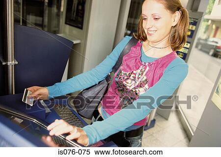Girl withdrawing money View Large Photo Image Stock Photography - Girl withdrawing money. Fotosearch