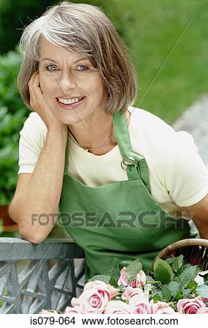 Woman gardening View Large Photo Image Picture - Woman gardening. Fotosearch