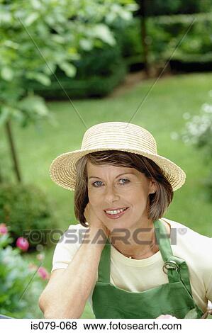 Stock Photo - Woman gardening. Fotosearch