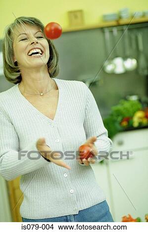 Woman in kitchen View Large Photo Image Picture - Woman in kitchen. Fotosearch
