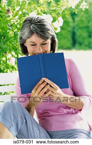 Woman reading book View Large Photo Image Stock Image - Woman reading book. Fotosearch