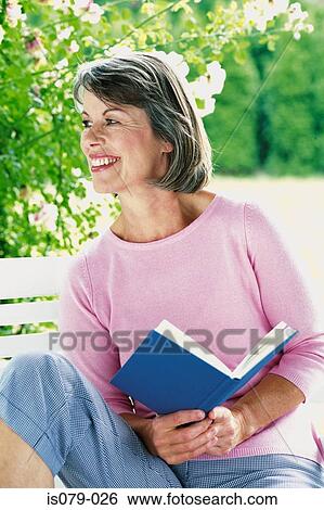 Woman reading book View Large Photo Image Stock Photograph - Woman reading book. Fotosearch