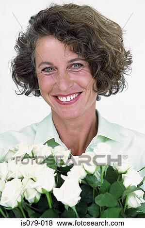 Woman with roses View Large Photo Image Stock Photo - Woman with roses. Fotosearch