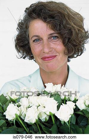 Stock Photograph - Woman with roses. Fotosearch