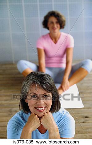 Stock Photography - Women in yoga class. Fotosearch