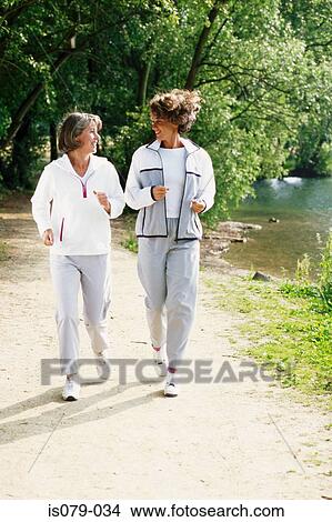 Women walking View Large Photo Image Picture - Women walking. Fotosearch