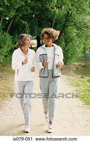 Women walking View Large Photo Image Stock Image - Women walking. Fotosearch