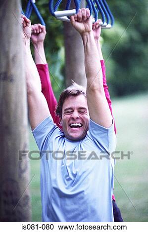 Couple on obstacle course View Large Photo Image Stock Image - Couple on obstacle course. Fotosearch