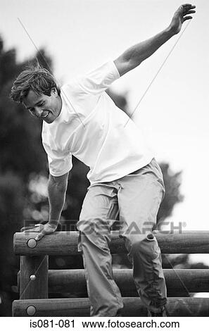 Man on obstacle course View Large Photo Image Stock Image - Man on obstacle course. Fotosearch
