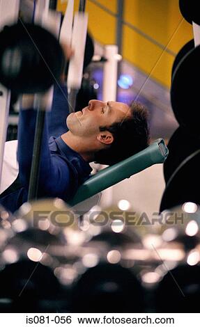 Stock Photograph - Man weigth-training. Fotosearch