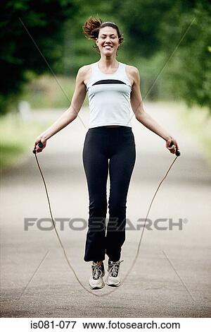 Stock Photo - Woman skipping. Fotosearch