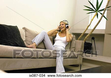 Picture - Girl listening to music. Fotosearch
