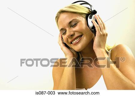 Stock Photo - Girl listening to music. Fotosearch - Search Stock Images, Poster Photographs, Pictures, and Clip Art Photos