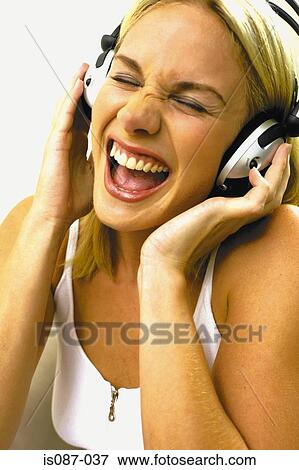Girl listening to music View Large Photo Image Stock Photo - Girl listening to music. Fotosearch