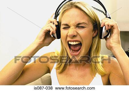 Girl listening to music View Large Photo Image Stock Photo - Girl listening to music. Fotosearch