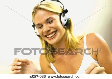 Girl listening to music View Large Photo Image Stock Photograph - Girl listening to music. Fotosearch