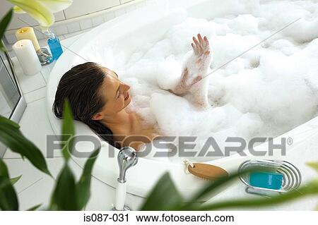 Stock Image - Woman in bath. Fotosearch