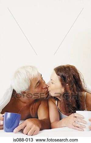 Stock Image - Couple in bed. Fotosearch