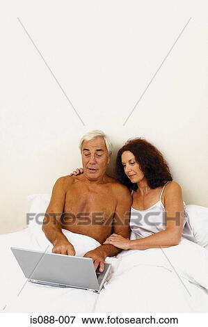 Stock Photo - Couple in bed. Fotosearch