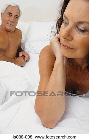 Couple in bed View Large Photo Image Stock Photo - Couple in bed. Fotosearch