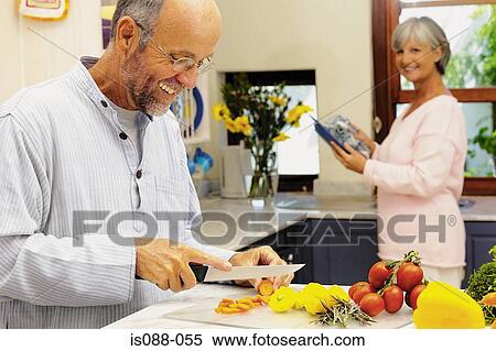 Stock Photography - Couple in kitchen. Fotosearch