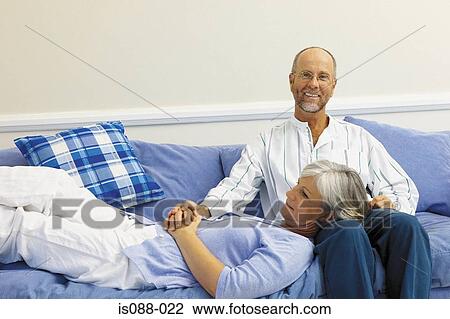 Couple on sofa View Large Photo Image Stock Image - Couple on sofa. Fotosearch