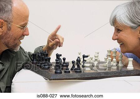 Couple playing chess View Large Photo Image Stock Photo - Couple playing chess. Fotosearch