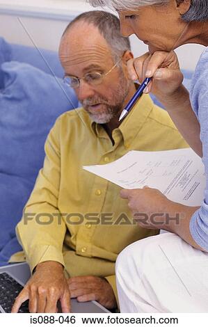 Couple working together View Large Photo Image Stock Photograph - Couple working together. Fotosearch