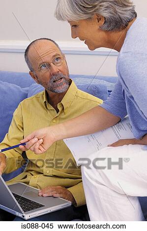 Couple working together View Large Photo Image Stock Photography - Couple working together. Fotosearch