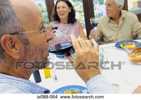 Friends eating together View Large Photo Image Picture - Friends eating together. Fotosearch
