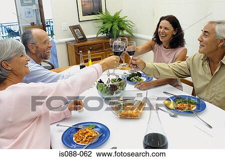 Friends eating together View Large Photo Image Stock Image - Friends eating together. Fotosearch