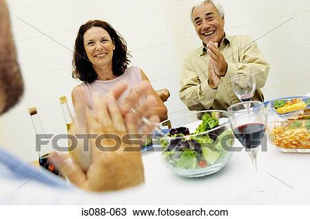 Friends eating together View Large Photo Image Stock Image - Friends eating together. Fotosearch