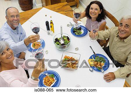 Friends eating together View Large Photo Image Stock Photography - Friends eating together. Fotosearch