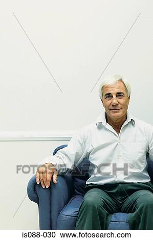 Man on sofa View Large Photo Image Stock Image - Man on sofa. Fotosearch