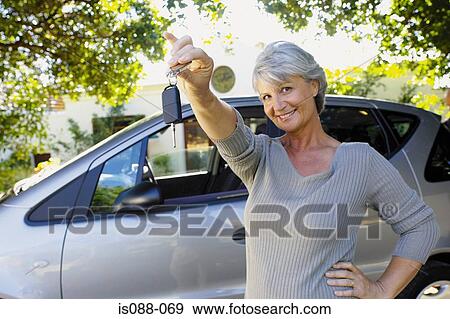 Woman holding car keys View Large Photo Image Stock Photo - Woman holding car keys. Fotosearch