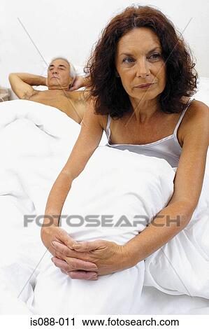 Stock Image - Woman in bed. Fotosearch
